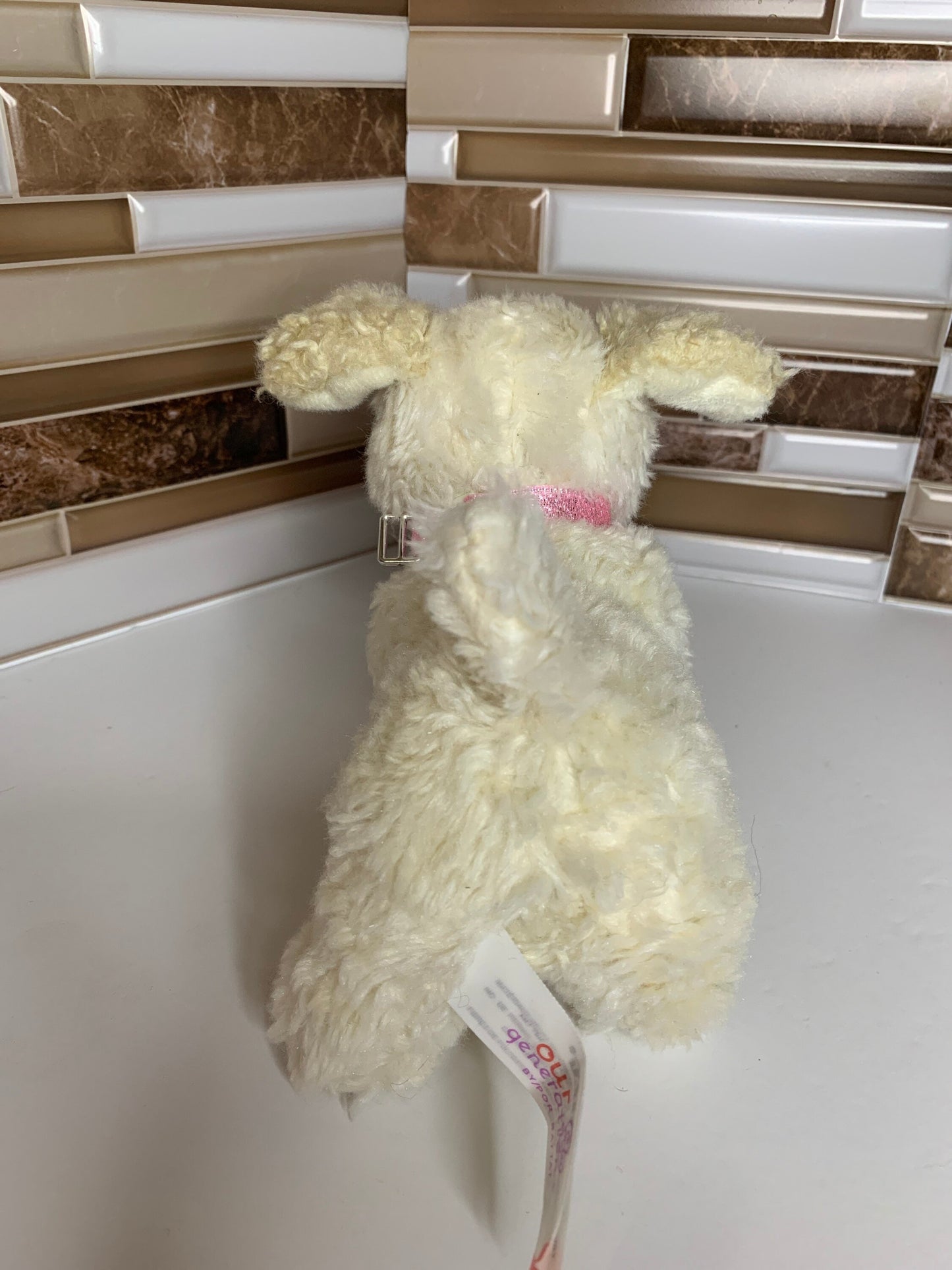 Small Our Generation Puppy Dog Plush. Possibly Poodle with pink collar.