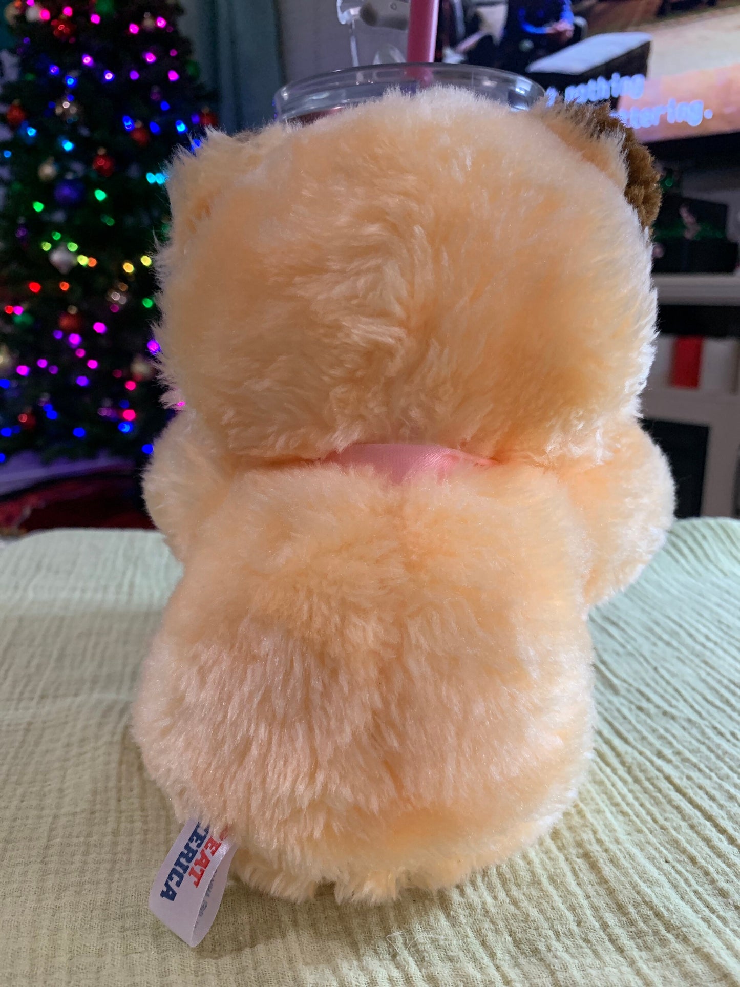 Vintage Great America Peach and brown Teddy Bear Plush with pink ribbon. 7.5”
