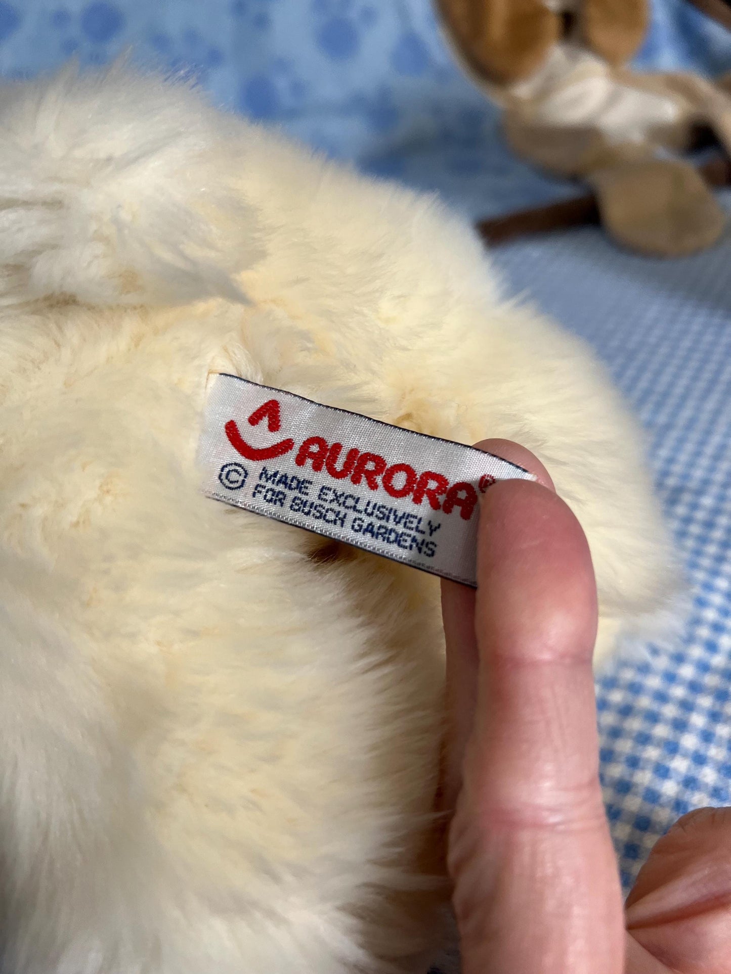 Aurora Sea World Busch Gardens White Polar Bear Plush. Red London Hoodie Laying Down