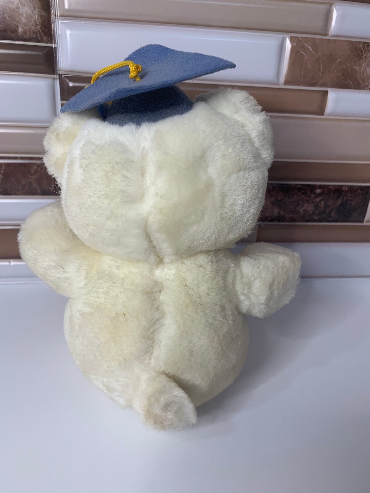 White graduation teddy bear. Blue cap yellow tassel. Small. 1980’s