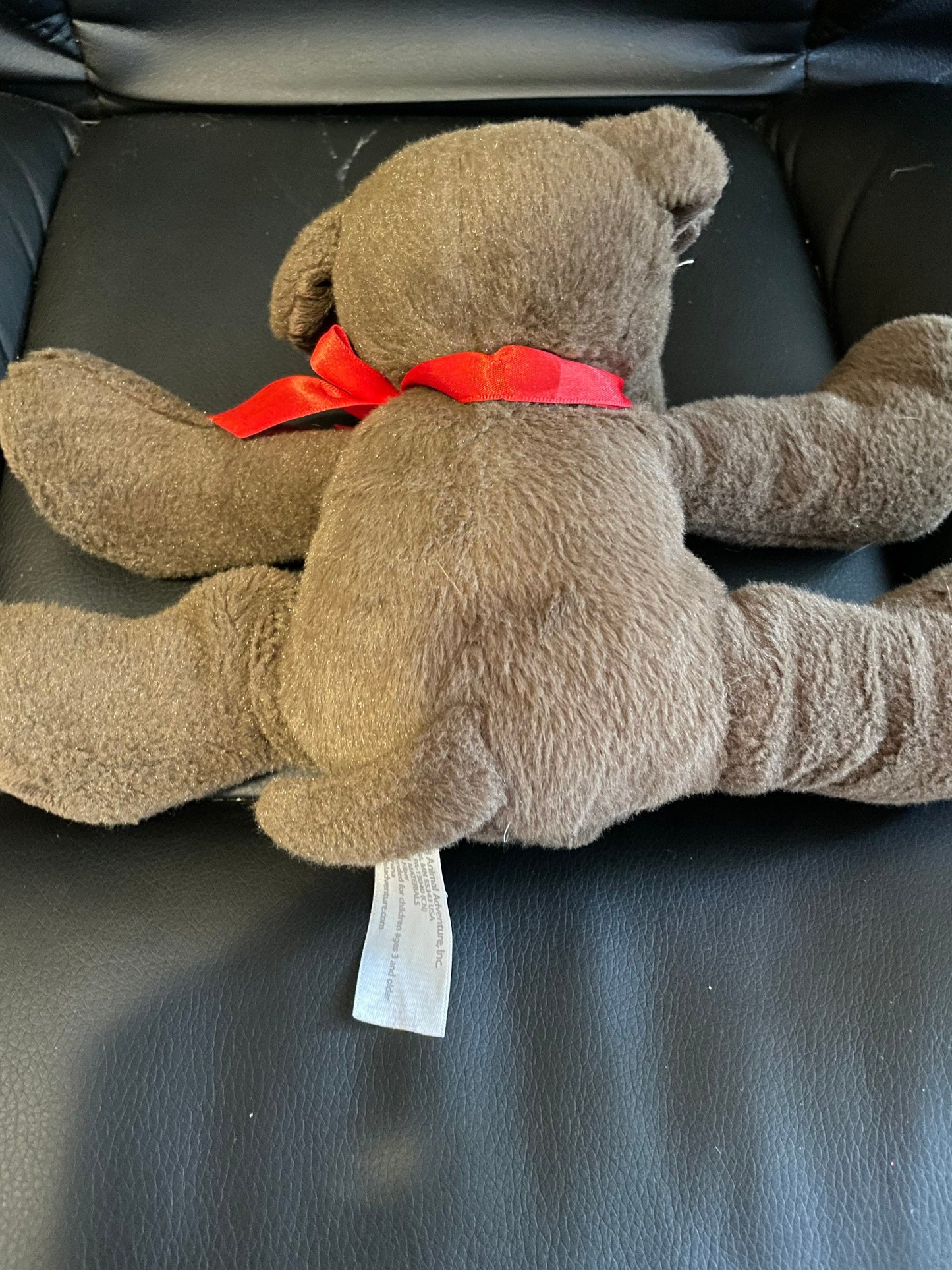 Animal Adventure Brown dog plush with red ribbon