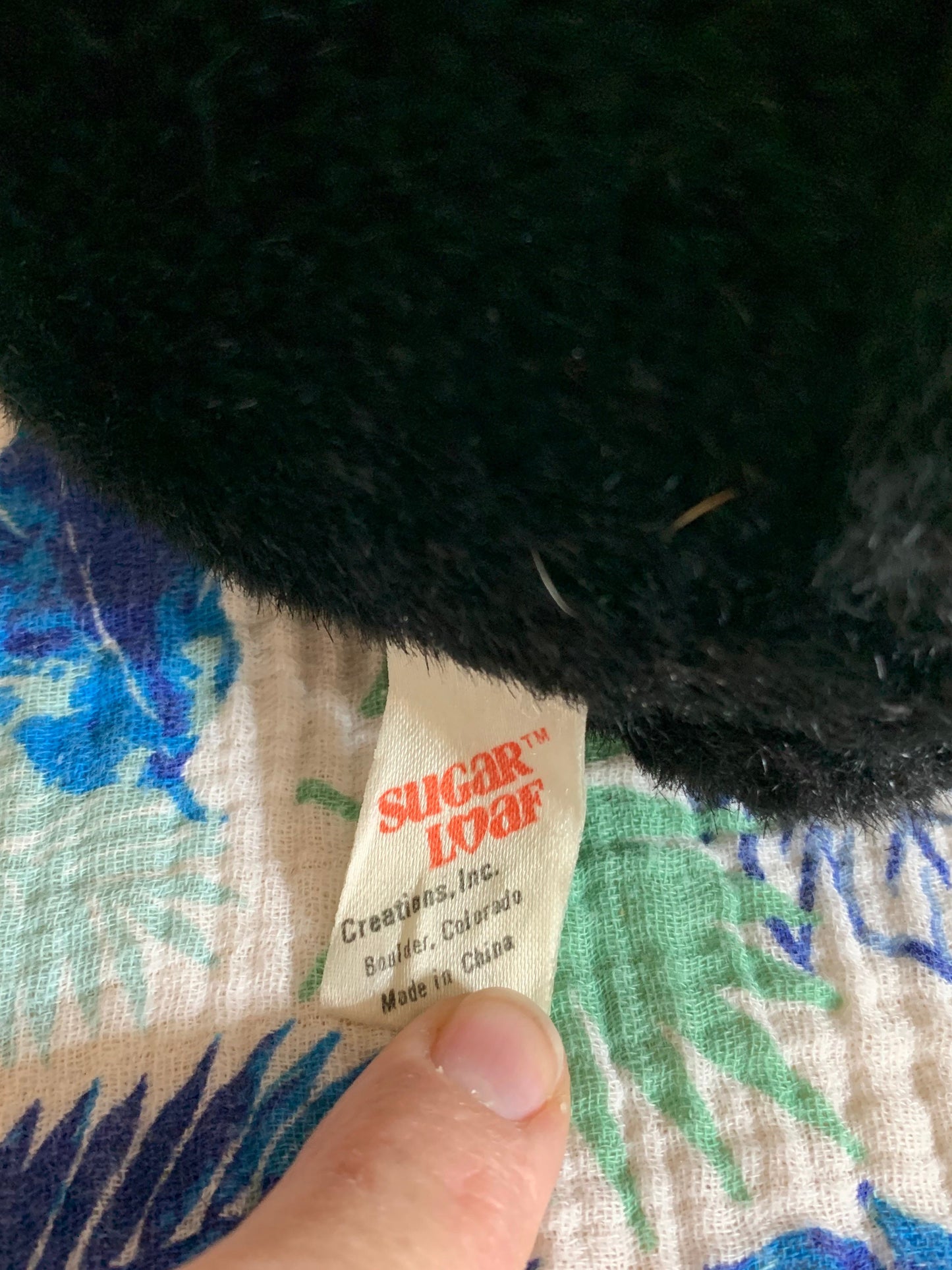 Vintage 1988 Sugar Loaf Black Bear Plush with Yellow Butterfly on nose.
