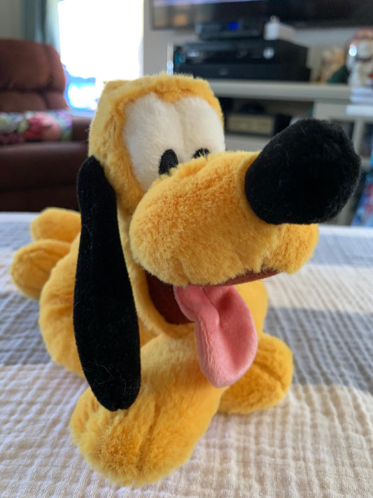Disneyland Disney Parks Pluto Plush. Smaller. 5” tall. 10” long. Excellent condition!