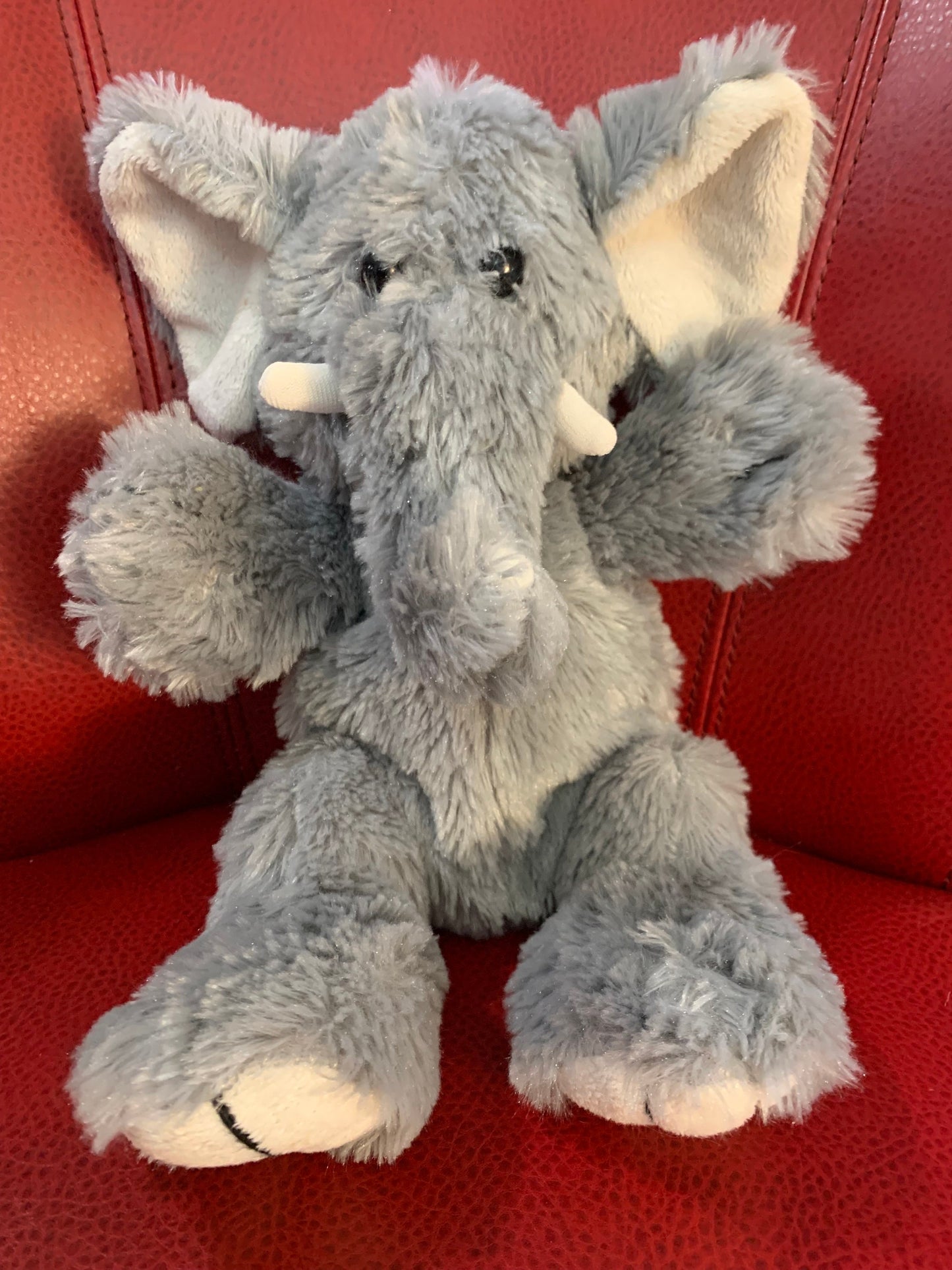 Elephant Plush. Unbranded. Gray and White with tusks. Very soft. Approximately 8-9”