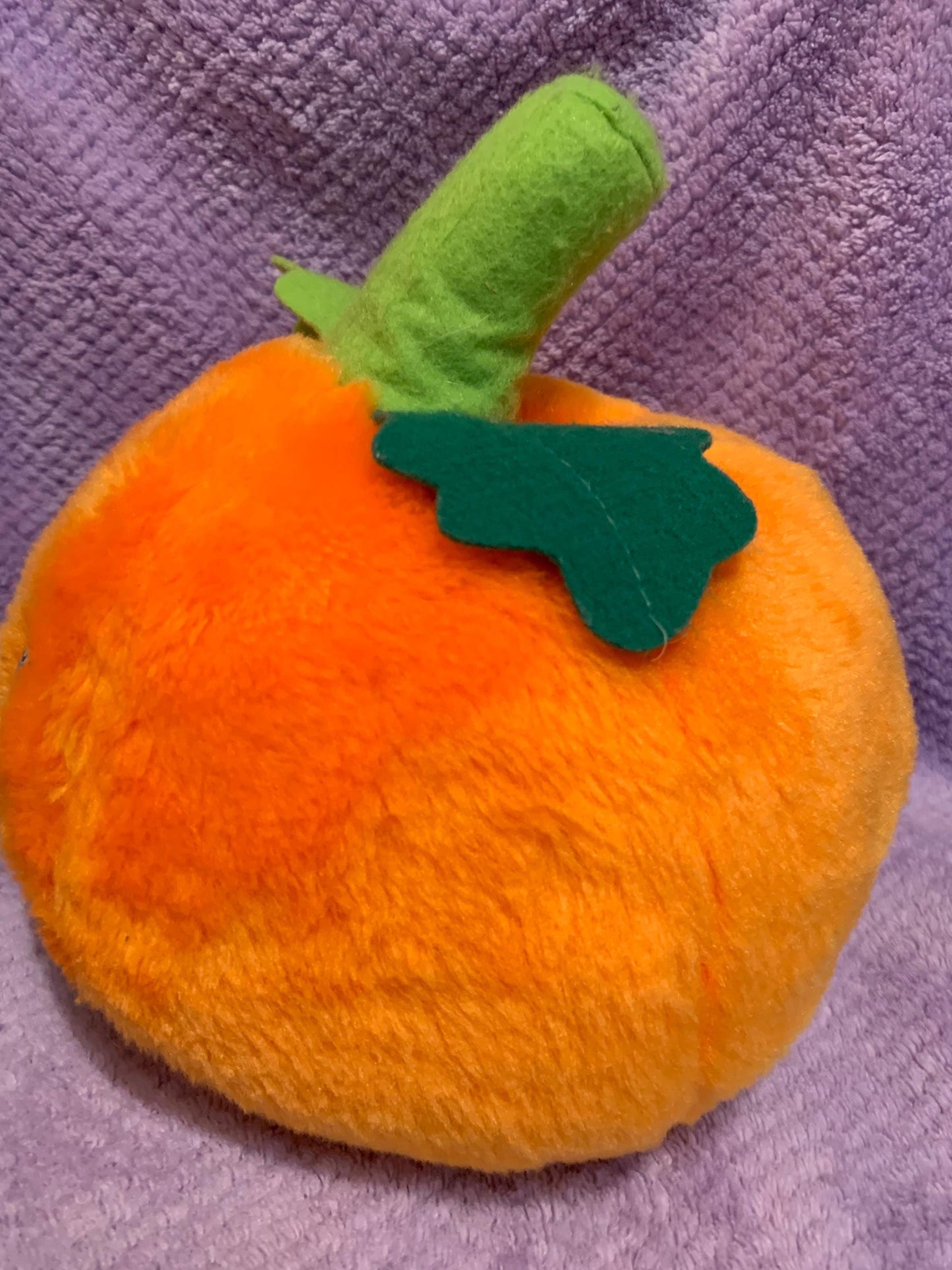 Orange Jack O’ Lantern Smiling Pumpkin Plush. Green Stem. Hard Plastic Purple Eyes. Vintage