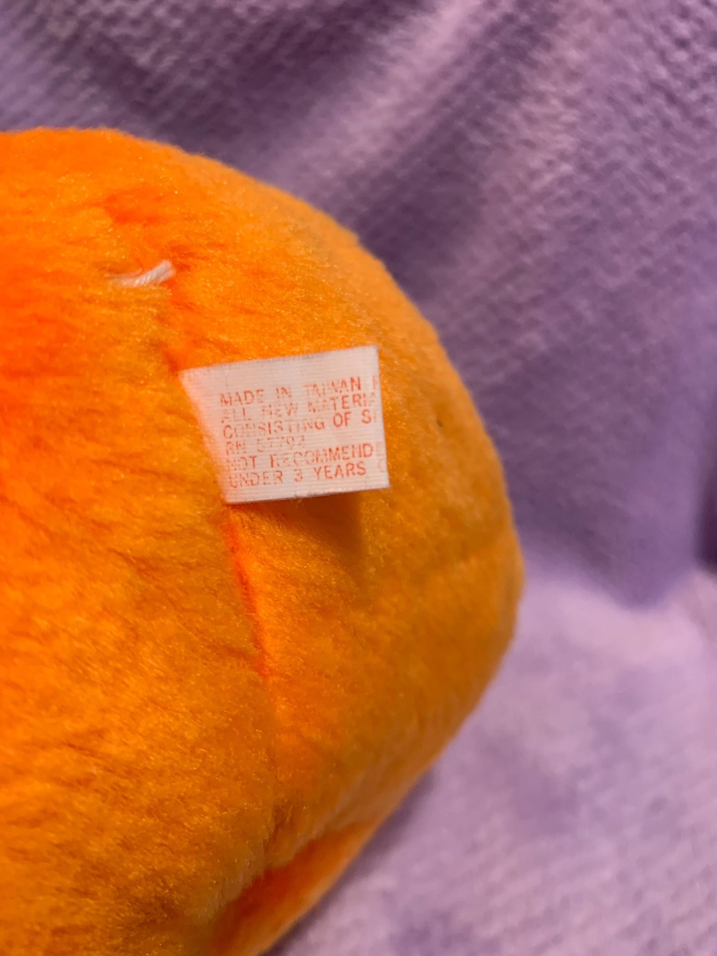 Orange Jack O’ Lantern Smiling Pumpkin Plush. Green Stem. Hard Plastic Purple Eyes. Vintage