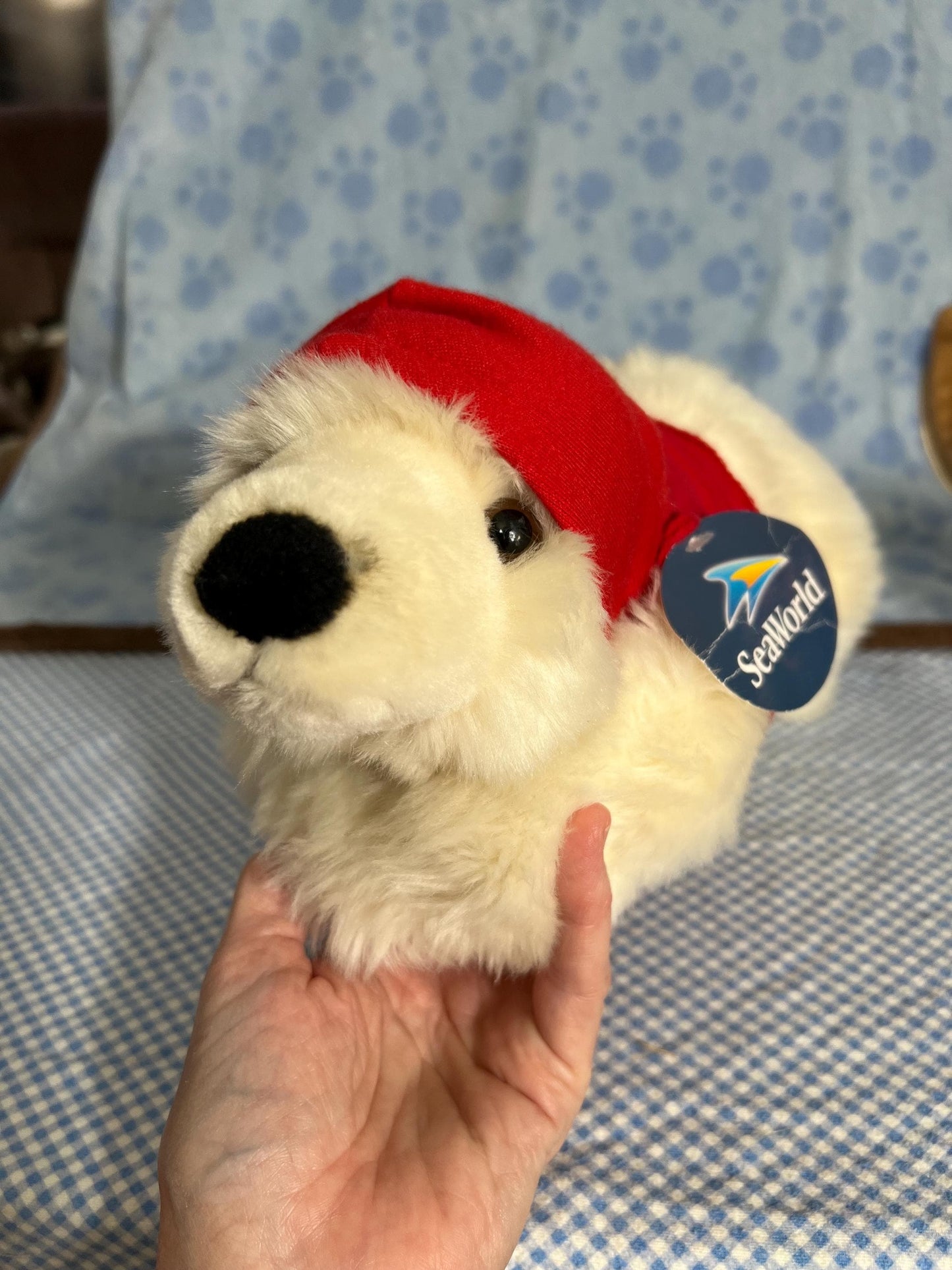 Aurora Sea World Busch Gardens White Polar Bear Plush. Red London Hoodie Laying Down