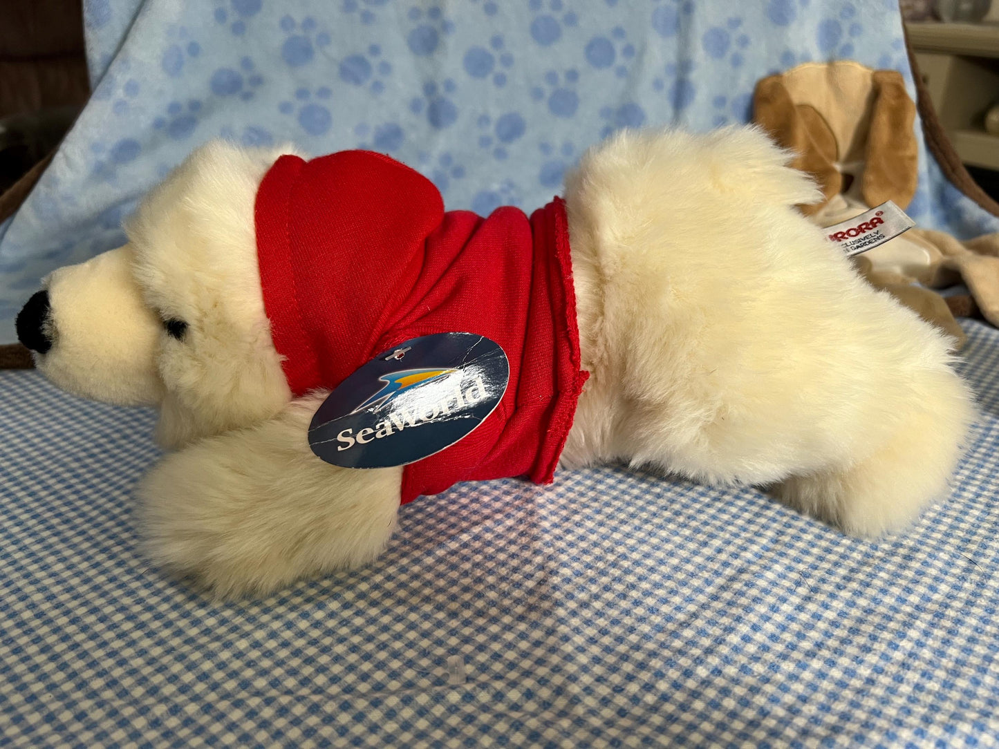 Aurora Sea World Busch Gardens White Polar Bear Plush. Red London Hoodie Laying Down