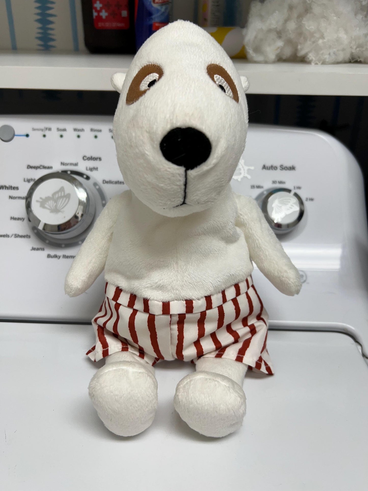 Ikea VANLIGHET White Dog Plush with red and white striped shorts.